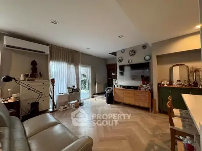 Spacious living room with modern decor and natural light