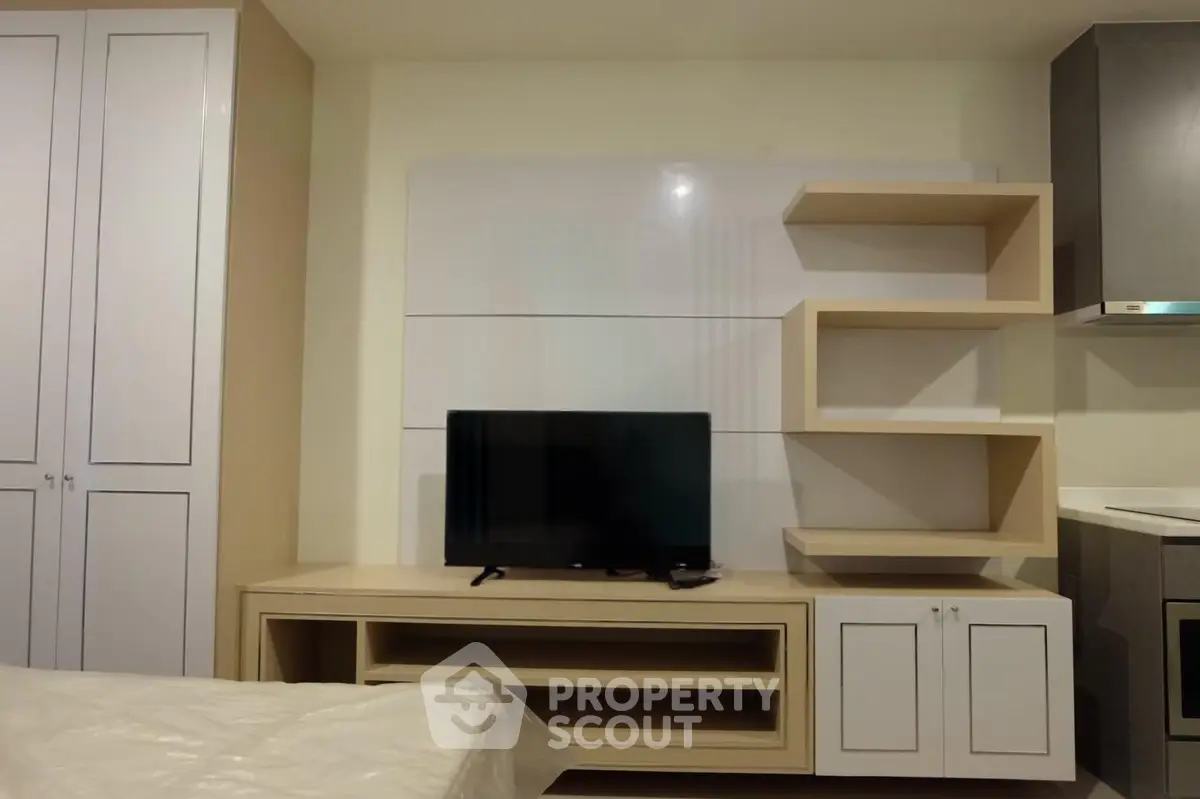 Modern living room with sleek TV unit and stylish shelving