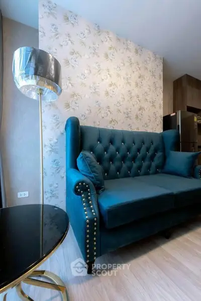 Elegant living room with plush blue sofa and stylish floor lamp