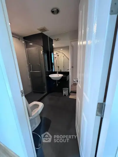 Modern bathroom with glass shower and sleek fixtures