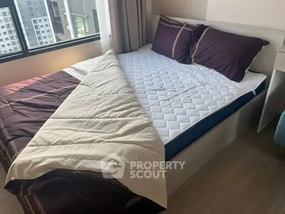 Cozy bedroom with modern decor and large window view