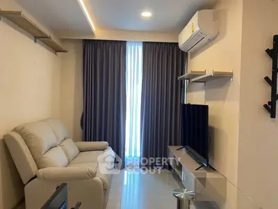 Modern living room with sleek furniture and air conditioning, perfect for comfort and relaxation.