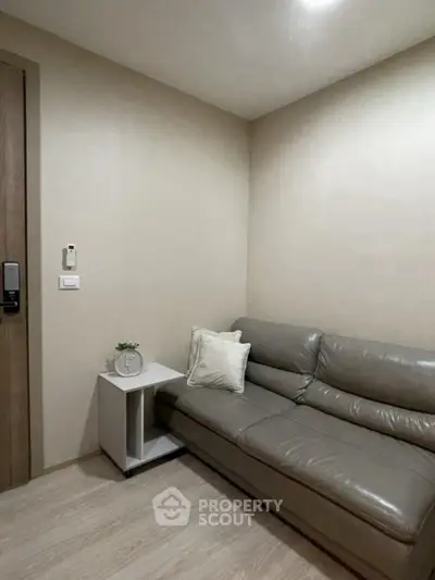 Cozy living room with modern leather sofa and minimalist decor