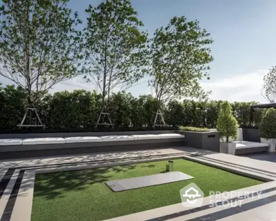 Luxurious rooftop garden with modern seating and lush greenery, perfect for relaxation and entertaining.