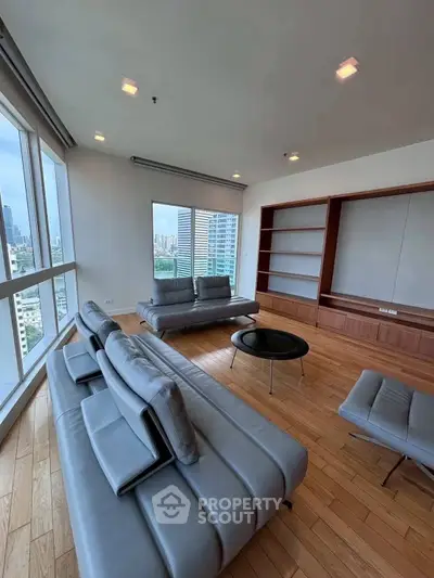 Spacious modern living room with city view and stylish furniture