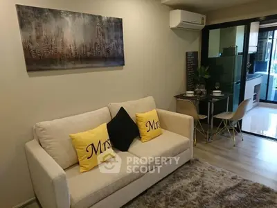 Modern living room with cozy sofa and dining area in open layout apartment
