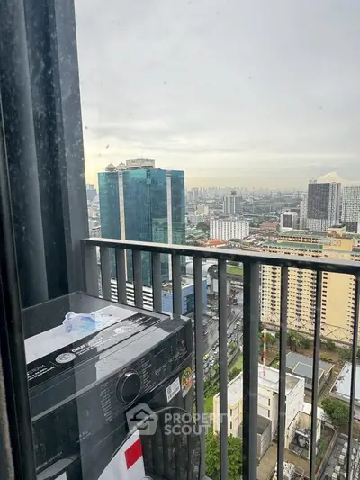 Stunning high-rise balcony view with cityscape and modern washing machine.