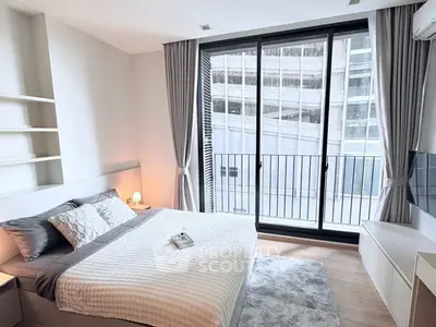Modern bedroom with large windows and stylish decor in urban apartment