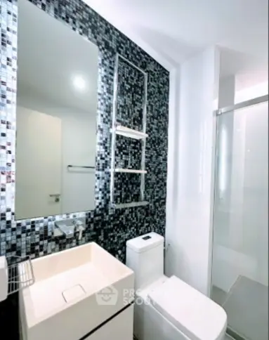 Modern bathroom with sleek design and mosaic tile accent wall