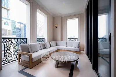 Luxurious balcony with elegant seating and city view, perfect for relaxation and entertaining.
