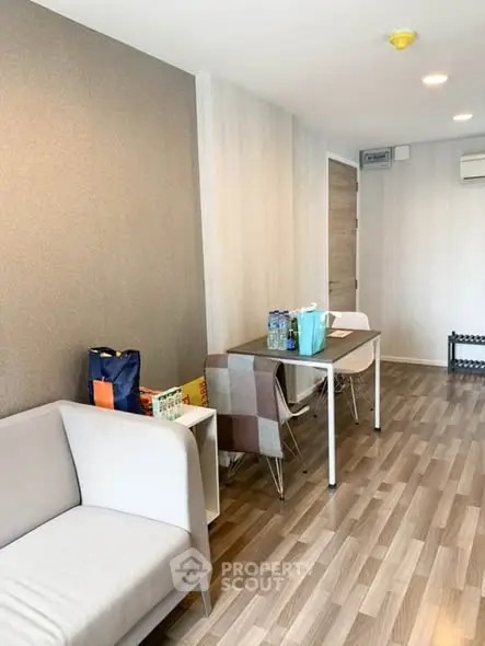 Modern living room with stylish decor and wooden flooring