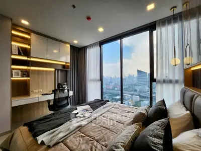 Luxurious bedroom with stunning city view, modern decor, and elegant lighting in high-rise apartment.