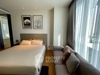 Modern bedroom with large window, cozy bed, and stylish decor in urban apartment.