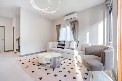 Modern living room with stylish furniture and natural light