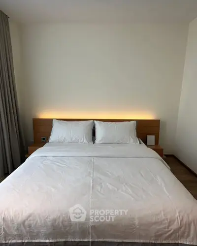 Modern bedroom with cozy lighting and minimalist design