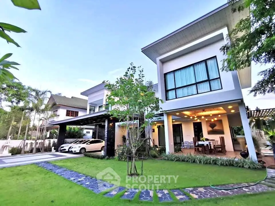 Stunning modern two-story home with lush garden and spacious driveway.