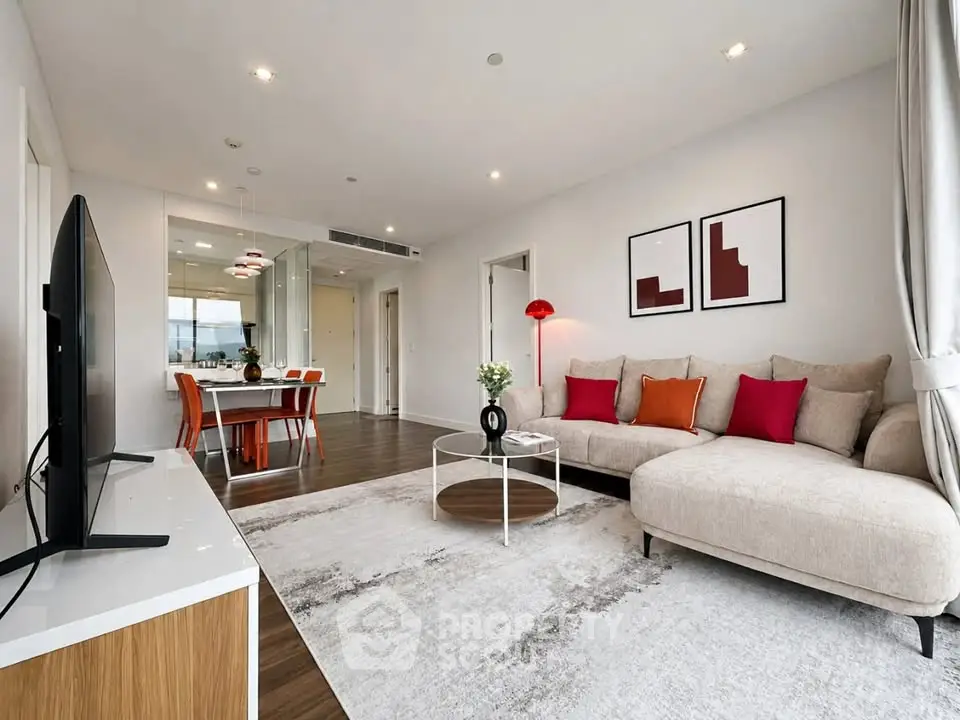 Spacious modern living room with stylish decor and open dining area
