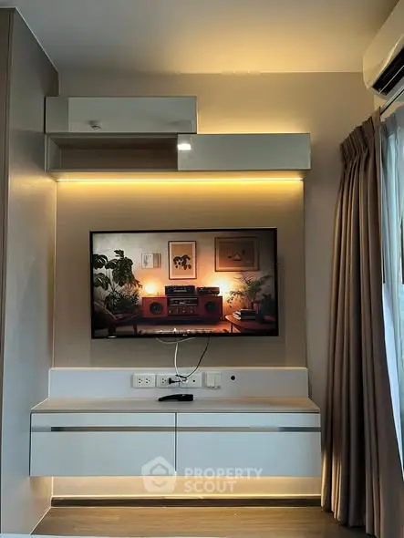 Modern living room with sleek TV setup and ambient lighting