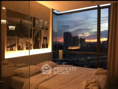 Luxurious bedroom with stunning city view at sunset, featuring modern decor and cozy ambiance.