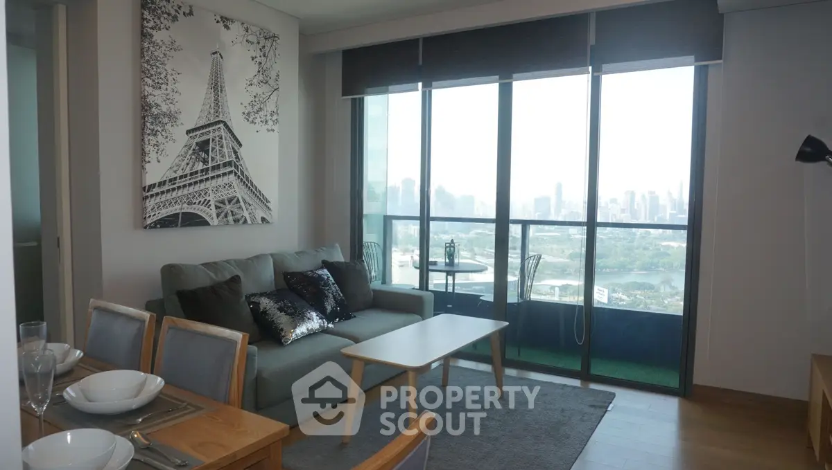 Modern living room with city view, stylish decor, and natural light