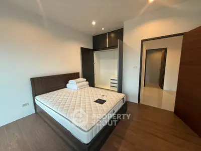 Spacious bedroom with modern design and built-in wardrobe, perfect for comfortable living.