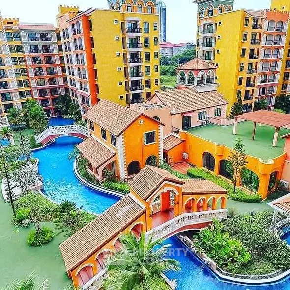Stunning Mediterranean-style apartment complex with vibrant colors and lush landscaping.