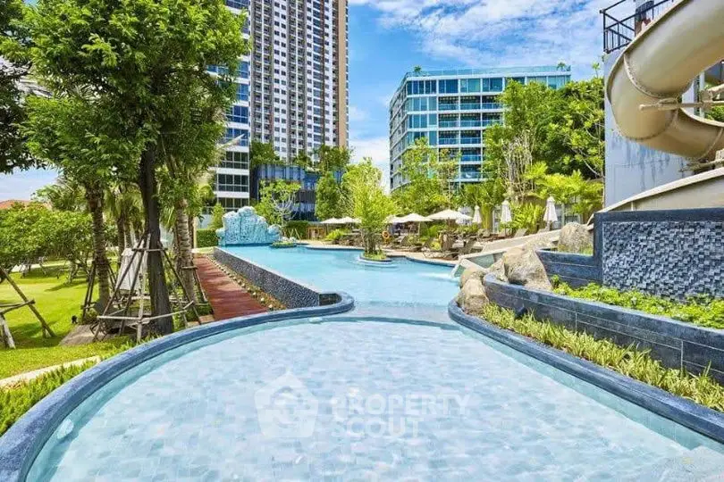 Luxurious condominium with stunning pool and lush garden view