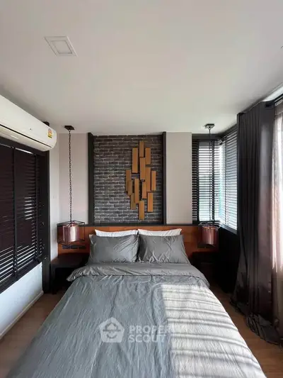 Modern bedroom with stylish decor and large windows for natural light