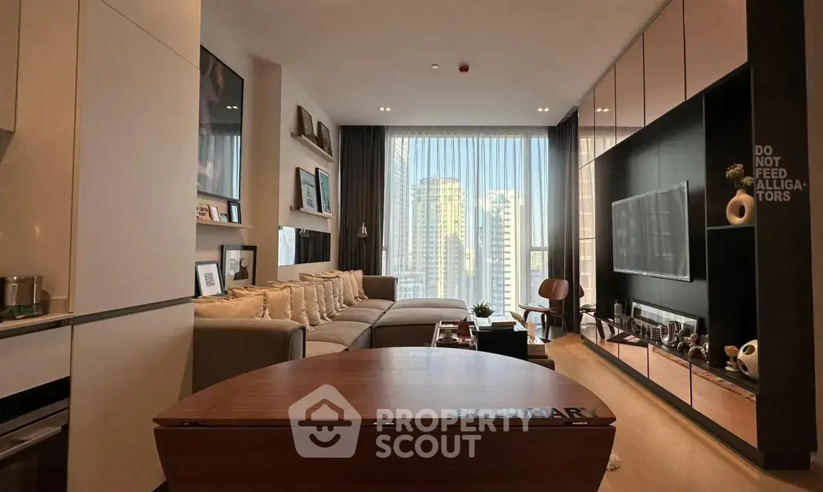 Luxurious modern living room with city view, elegant decor, and ample natural light.