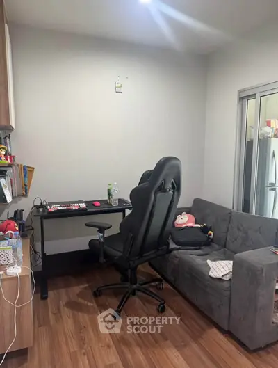 Cozy study room with modern desk and comfortable chair, perfect for productivity and relaxation.