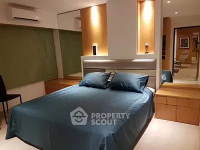 Modern bedroom with stylish lighting and elegant decor, featuring a comfortable bed and sleek furnishings.