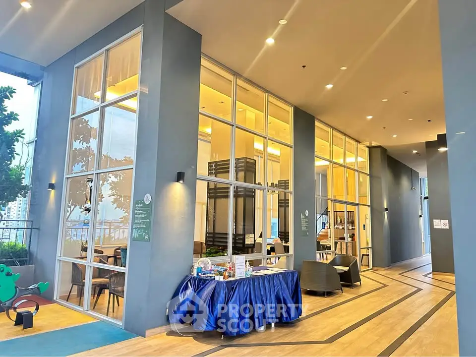 Modern building entrance with high ceilings and elegant decor