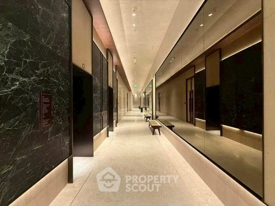 Luxurious modern hallway with marble walls and elegant lighting
