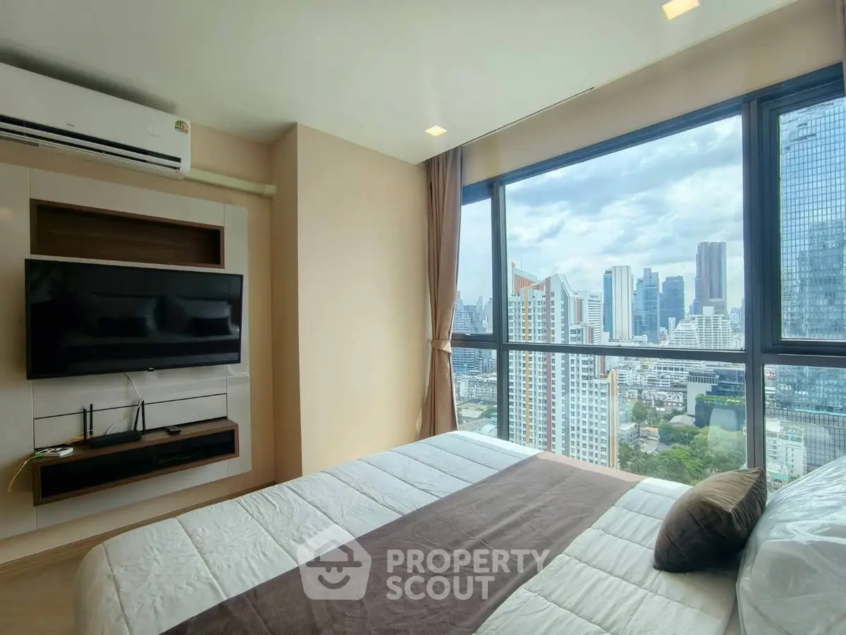 Modern bedroom with stunning city view and large windows