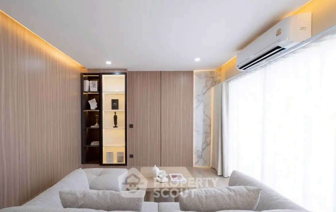 Modern living room with elegant lighting and cozy seating area