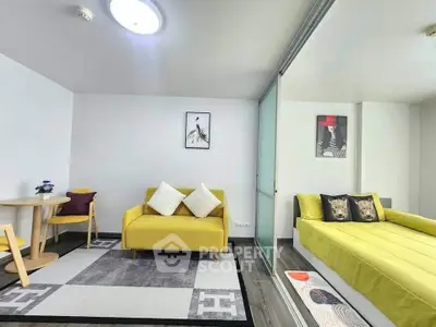 Modern studio apartment with vibrant yellow decor and cozy furnishings