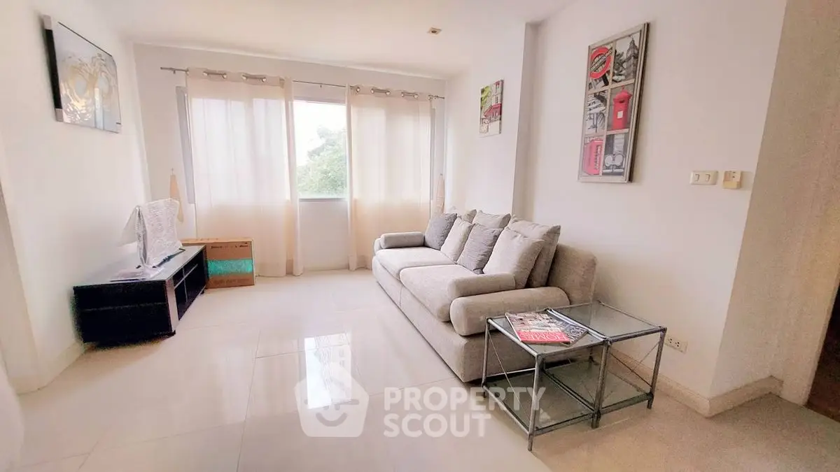 Bright and modern living room with large windows and stylish decor
