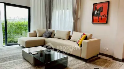 Stylish modern living room with large windows and elegant decor