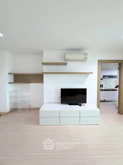 Modern living room with minimalist design and sleek TV setup