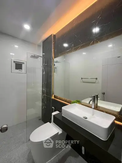 Modern bathroom with sleek design and ambient lighting