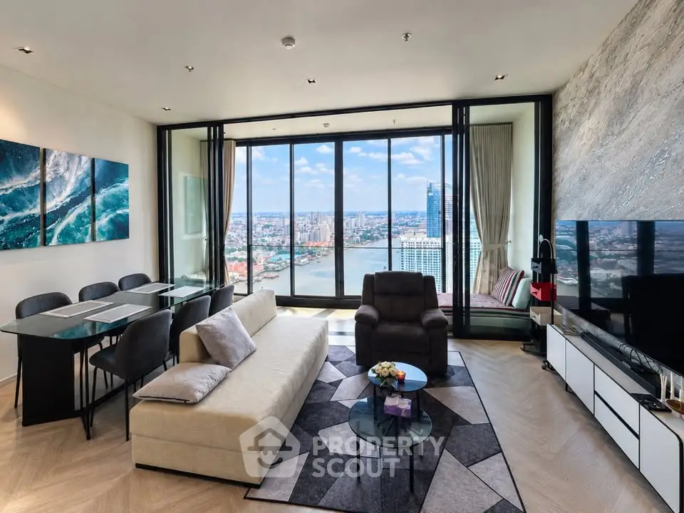 Luxurious living room with stunning city and river view, modern furniture, and elegant decor.