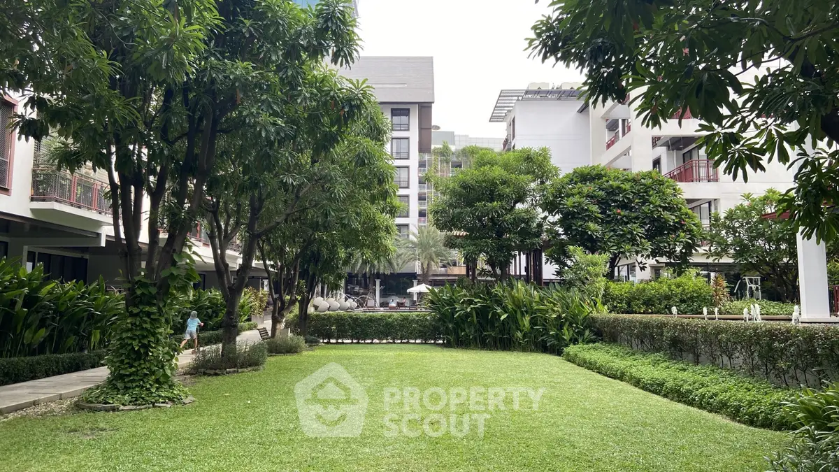 Lush garden view in modern residential complex with green landscaping