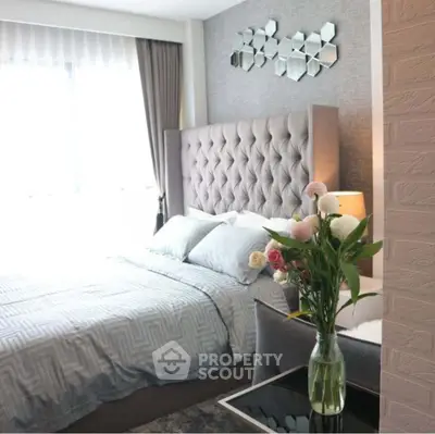 Luxurious bedroom with plush headboard and elegant decor