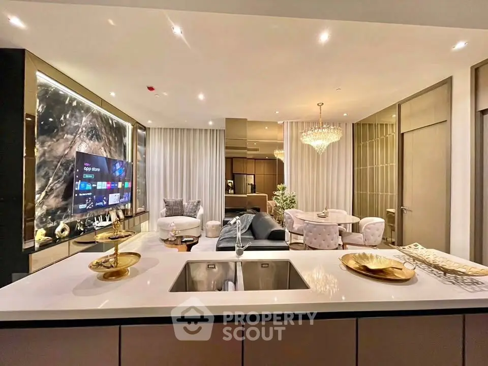 Luxurious open-plan living room with modern kitchen and elegant decor