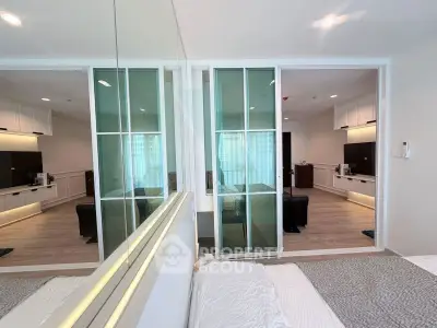 Modern bedroom with sliding glass doors and stylish interior design