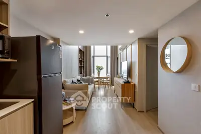 Modern living room with open kitchen and stylish decor