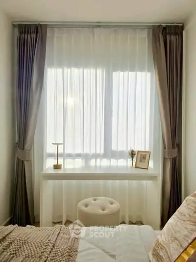 Cozy bedroom with elegant curtains and natural light