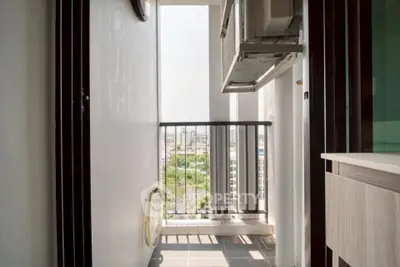 Charming balcony with city view, perfect for relaxation and enjoying the outdoors in a modern apartment.