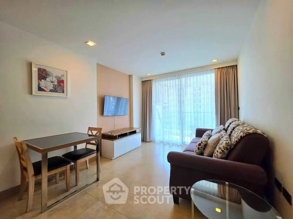 Modern living room with stylish decor and large window for natural light