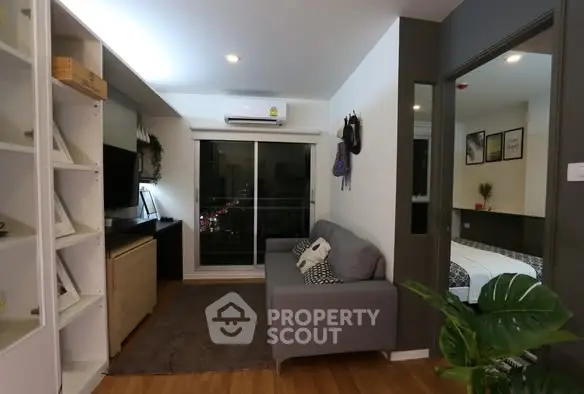 Modern living room with cozy sofa and balcony view in stylish apartment